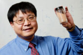 Jian Ku Shang, a professor of materials science and engineering, holds a sample of a new photocatalytic material that uses visible light to destroy harmful bacteria and viruses, even in the dark.