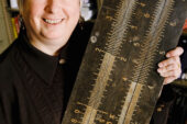 Lori Kendall, a professor in the Graduate School of Library and Information Science, says despite the increased popularity of geek culture and the ubiquity of computers, the geek's close cousin, the nerd, still suffers from a negative stereotype in popular culture. Kendall holds a familiar tool of the nerd: a slide rule.