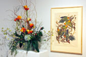 The colors in a painting of parakeets inspired this floral arrangement at the 2009 Petals & Paintings exhibition at Krannert Art Museum.