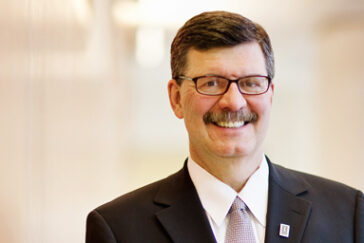 The new online MBA degree will democratize access to the coveted graduate degree, said Larry DeBrock, the Josef and Margot Lakonishok Endowed Dean of the College of Business.
