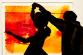 Dancers attending a milonga at Krannert Art Museum tango past a piece by Andy Warhol.