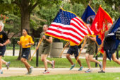 Navy Capt. Charles C. Moore, who also is the Urbana campuss Navy ROTC commanding officer, leads the pack Sept. 10 during the annual campus run to remember the victims of 9/11. He is followed by Navy Midshipman 1st Class Sheryl Acuna, who is the Navy ROTC battalion commander, and Midshipman 1st Class David Mielnik.