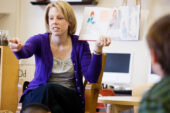 Graduate student Emily Paulsen reads stories to kindergarteners about their similarities with children who have disabilities.