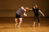 Using Alexander Technique, dance professor Rebecca Nettl-Fiol guides a student in a movement exploration designed to help him learn to lead with his head.