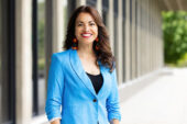 Professor Rochelle Gutierrez standing outside the education building on campus.