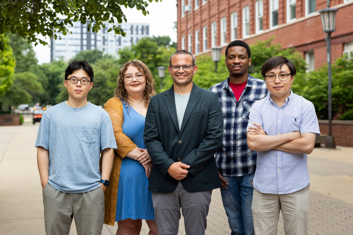 Portrait of the researchers standing outside on campus.