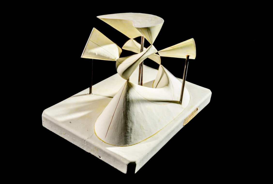 Photo of a plaster model of multiple curving surfaces.