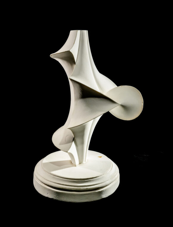 Photo of a plaster model of various curving surfaces.