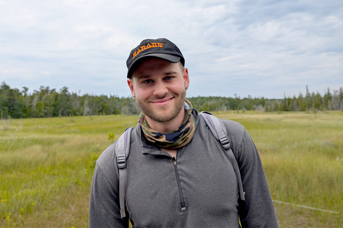 Photo of Brian Charles in an open field