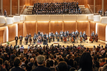Photo of Sinfonia da Camera onstage at the Great Hall in Krannert Center for the Performing Arts, with the audience in the foreground.