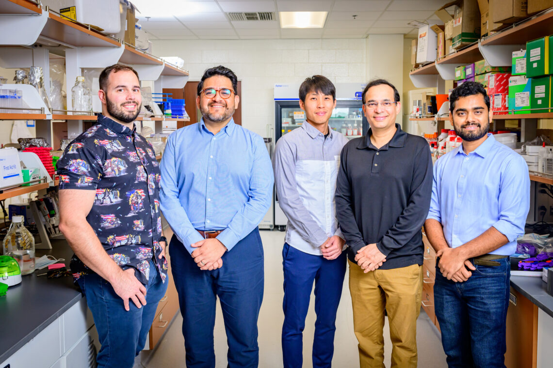 Photo of researchers in laboratory. 