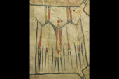 Photo of a painted hide robe with a thunderbird in red, yellow and black.