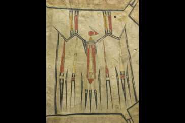 Photo of a painted hide robe with a thunderbird in red, yellow and black.
