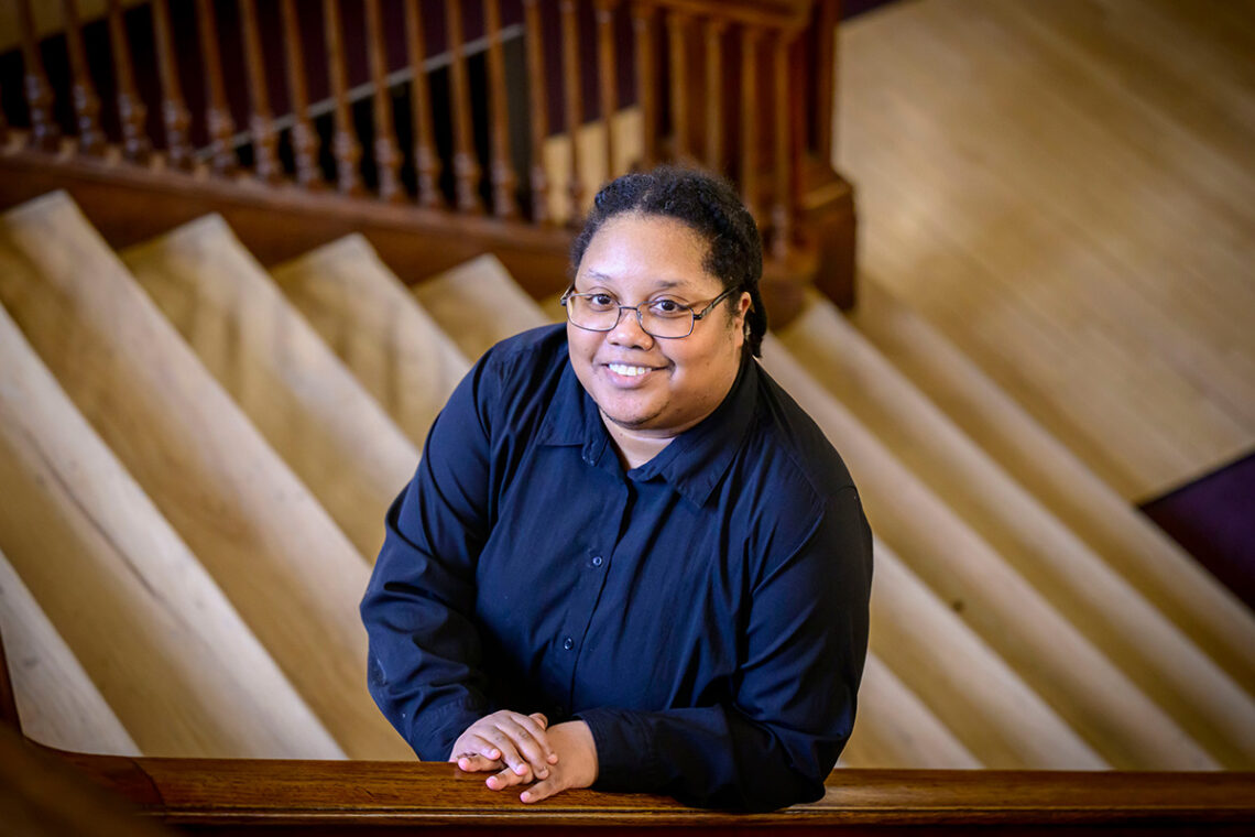 Photo of the researcher in a stairwell in a campus building.