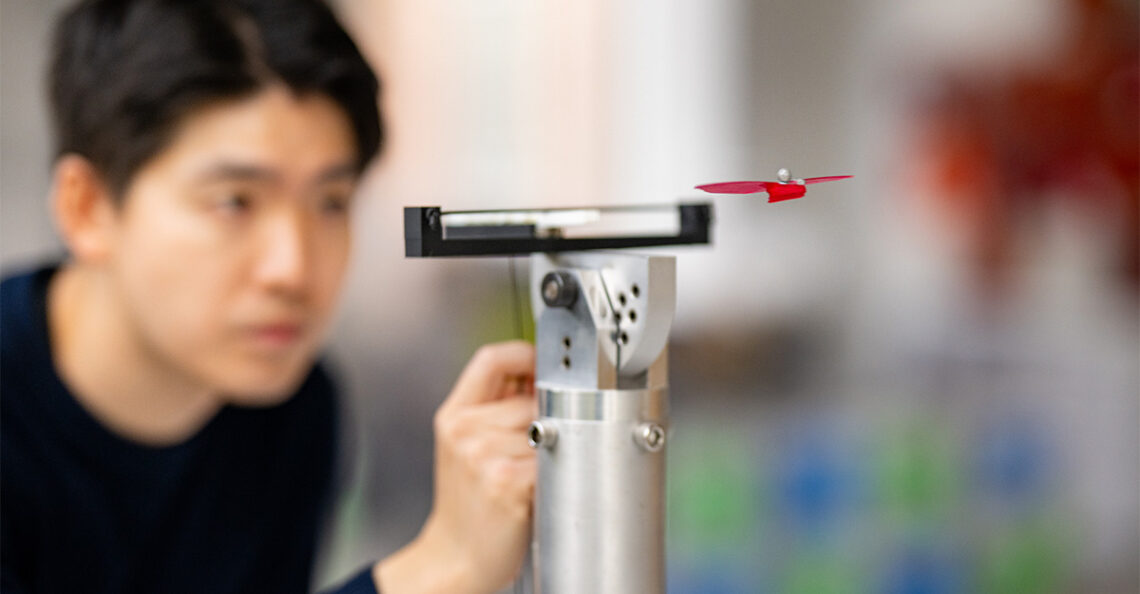 Photo of Princeton co-author Paul Lee launching the glider from a platform.