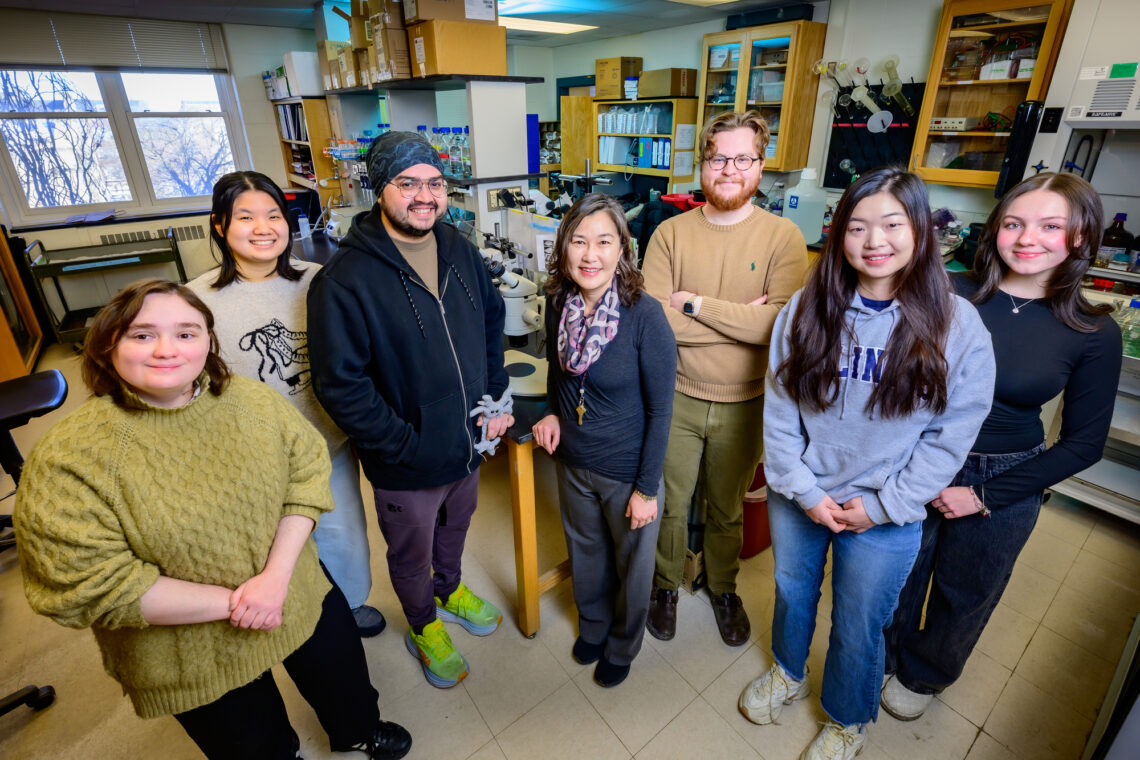A group of people standing in a lab