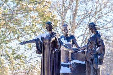 The Alma Mater statue with a dusting of snow