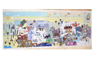 Photo of a 16-foot-long arpillera depicing scenes of Lota, Chile.