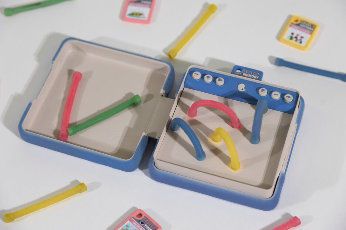 Photo of a toy with flexible rods that are placed on a board.