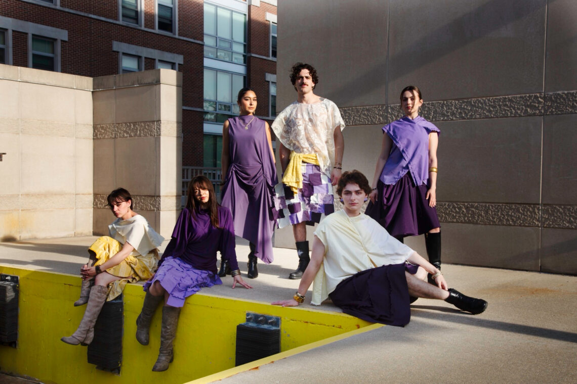 Photo of six models wearing clothing in shades of yellow and purple.