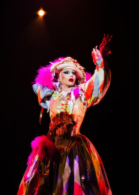 Photo of the drag queen Sasha Velour in a colorful outfit.