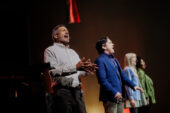 Photo of four people singing, with Nathan Gunn in the foreground.