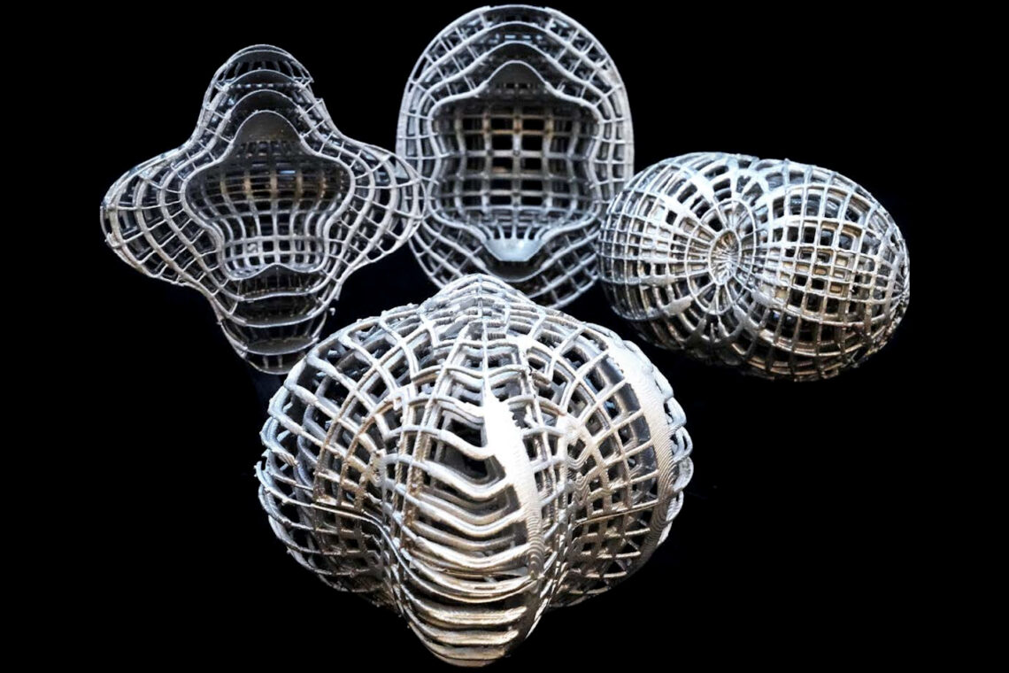 This image exhibits an a array of 3D thermal cloaking prototype designs created using 3D-printed aluminum and molded rubber.