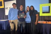 The four team members who competed standing together on stage at the competition.