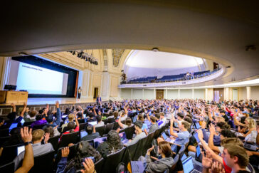 Students in an academic auditorium at the University of Illinois Urbana-Champaign