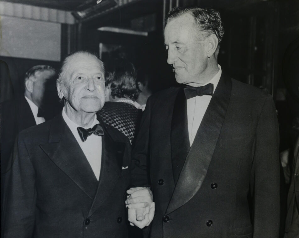 Black and white photo of Ian Fleming with author Somerset Maugham.