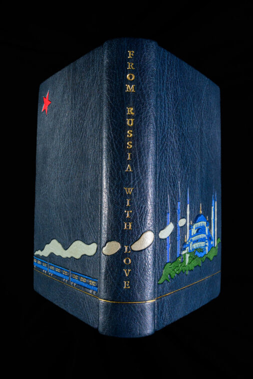 A photo of the “From Russia With Love” cover, with a blue mosque, red star and the Orient Express with steam billowing across the book’s binding.